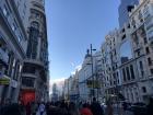 Walking along Gran Vía, one of the main shopping streets in Madrid