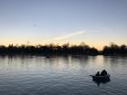 Sunset while people still row on El Lago