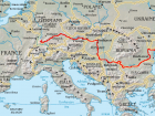The red line in this map shows the Danube River. Can you find where it travels through Romania and meets the Black Sea?