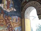 A view of a mural of Christian judgement on the entrance to the old monastery