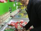 My friend Jiawei searches through his local grocery market for "Tangyuan", a sweet kind of dumpling that many Chinese people eat during the New Year holiday