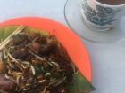 Malaysian Chinese cuisine with a plate of noodles and kofi (coffee)