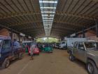 Truck beds and tuk-tuks full of greens