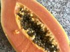 Half of a fresh papaya before removing the seeds