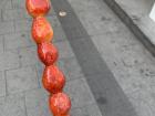 Strawberries on a stick coated with honey