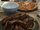 I ate some ribs (front) and my friend ate some pizza (back)