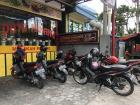Shops often have motorcycle parking but not car parking