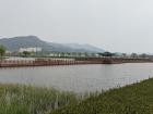 The park had a beautiful pond and mountain in the background