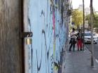 Friends Imari and Guillermina walking by street art in Montevideo.