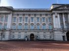 Buckingham Palace always has armed soldiers standing at attention outside