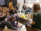 A group of friends from the research group spending time together, with me on the floor in the bottom left playing with baby Max