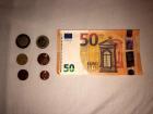 Here are 50€ bill, a 2€ and 1€ coin, and some other change
