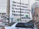The wall is covered with paintings and quotes
