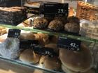 Different countries have different foods and currencies, like these Norwegian pastries sold in krones