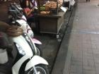 Food stalls are often surrounded by the mopeds of individuals trying to satisfy their hunger