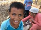 Fahri after the harvest with his grandmother and cousin