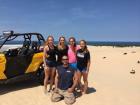 At the top of Silver Lake's highest sand dune with some of my sisters and my dad. We all love to be girls that do things typically dominated by boys.