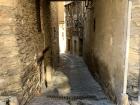 A side street tucked away in Ordino leading to homes and a quaint courtyard