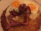 A rösti with bacon and eggs