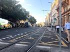 Here the trains run above ground, which is why there are tracks on the street