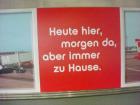 "Here today, there tomorrow, but always at home." A poster at Munich International Airport