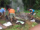 It rained while the Pib was underground, so it had to cook an extra 30 minutes. Once it was time to shovel the Pib out of the ground, everyone had to work fast so it wouldn't burn!