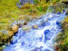 The water in this stream was very cold because it is fed by snow from the mountains