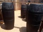After long hours of digging, shaping and painting each drum, they are ready for the next phase, which is placing animal skin on top