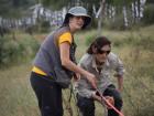 Volunteers helping with measuring fields