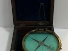 A small, boxed compass believed to have been aboard the James Caird for the famous journey to South Georgia Island