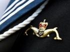 The "dolphins" pin earned by Royal Navy Submariners