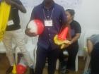 David uses the game of soccer to teach about health while wearing his favorite red hat