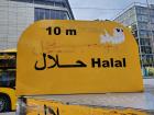 A sign in Dresden for an Arabic restaurant advertising its Halal menu, meaning that practicing Muslims can eat there