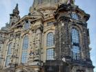 The black wall in front of the Frauenkirche is a burnt original wall from the Frauenkirche