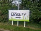 "Welcome to Mosney" sign