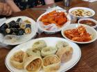 Trying popular foods shows which ingredients are important and easily accessible to that culture 