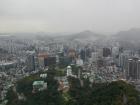 A shot from up high on Seoul Tower shows how nature and tightly packed buildings struggle to exist together