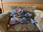 Then I suck all the air out with a vacuum hose, making the bags smaller 