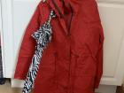 A long rain coat and umbrella to keep dry