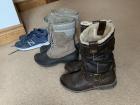 A pair of warm boots, tennis shoes and waterproof boots for hiking