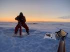 Researcher Micheal Angelopolous takes a core of the sea ice (Photo: Carolynn Harris)