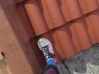 My foot is as big as each roof tile!