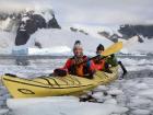 Sadra and Ihlara kayaking through the ice in Antarctica