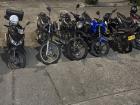 A parking area filled with Motos 