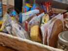 A basket of snacks on the table at my homestay, each one wrapped individually in plastic