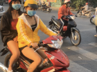 Mopeds are the most popular way to get around in Vietnam. There are very few driving regulations, making it seem scary to cross the street. Some mopeds will fit five people, including infants. 