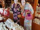 My sister and I pose with "kitsune" (fox) masks at the Fushimi Inari Shrine; kitsune is the "kami" (deity) of Inari Shinto shrines