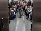 View of passengers in the next train carriage inside the train