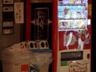 You can usually find recycling bins for plastic bottles or metal cans next to vending machines