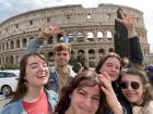 My friends and me in front of the Colosseum 